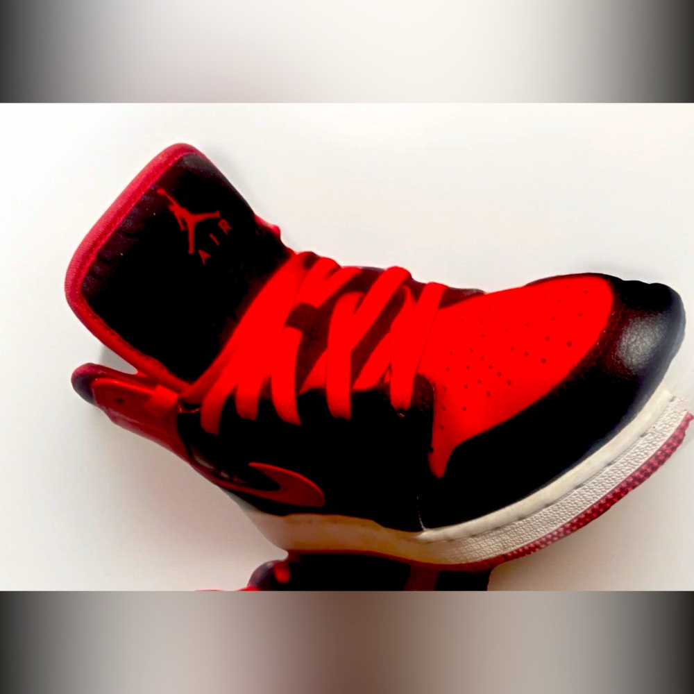 Jordan 1 Mid “Bred Toe” (GS) in Size 5.5Y. No creases look new no box.